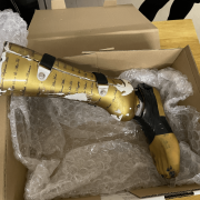 Adam Hills Donates Gold Prosthetic Foot to Charity